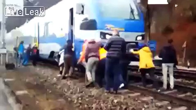 Passengers Pushing their Train at the Austrian-German Border