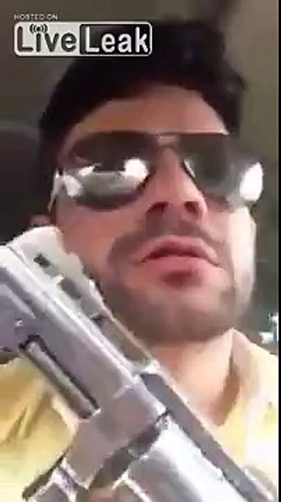 Guy shooting inside a car. (vertical video)