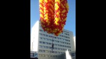 Girl flies in air with thousands of party balloons