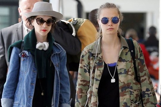Cara Delevingne and St Vincent hitch a ride on motorbikes after landing in London