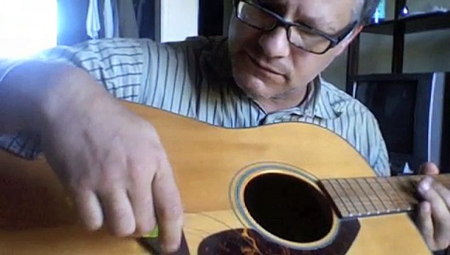 How to string a steel string acoustic guitar by Shaolin guitar teacher - Mobile
