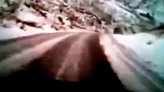 LiveLeak.com - SUV slides gracifully over the cliff