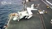 Navy Aircraft Landing on a Moving Aircraft Carrier