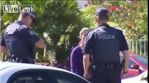 LiveLeak.com - Woman arrested for throwing dog poo at policeman'