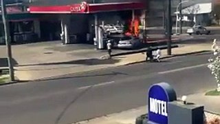Public Rescue Car Occupants Following Crash & Fire at Gas Station