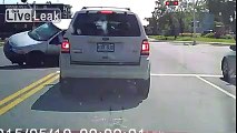 van flipped over by by idiot running a red light