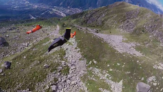 Crazy Guys in wingsuits jumping off a mountain in the Alps