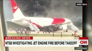 Plane catches fire on runway