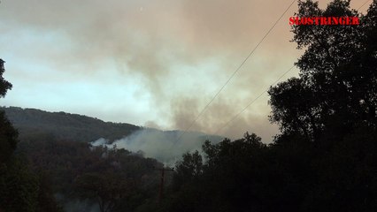 Plane dumps retardant over California fire