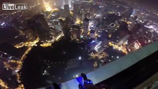 LiveLeak.com - Awesome night time base jump, With a cool pool landing.