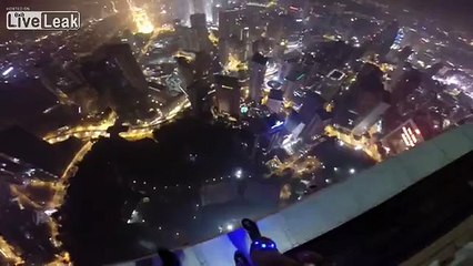 LiveLeak.com - Awesome night time base jump, With a cool pool landing.