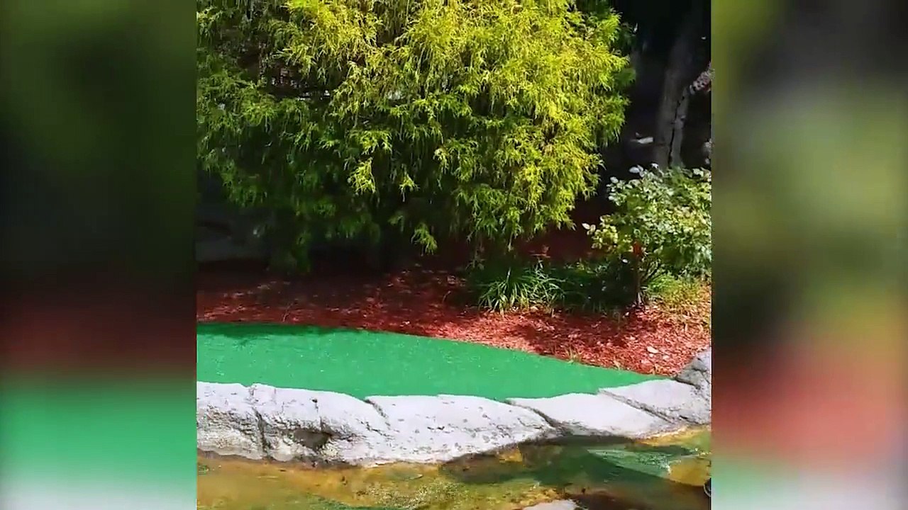 Kids having fun while playing mini golf