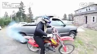 man rides motorcycle in the fire
