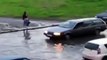 Russian daredevil goes water skiing down flooded street