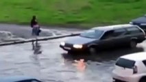 Russian daredevil goes water skiing down flooded street