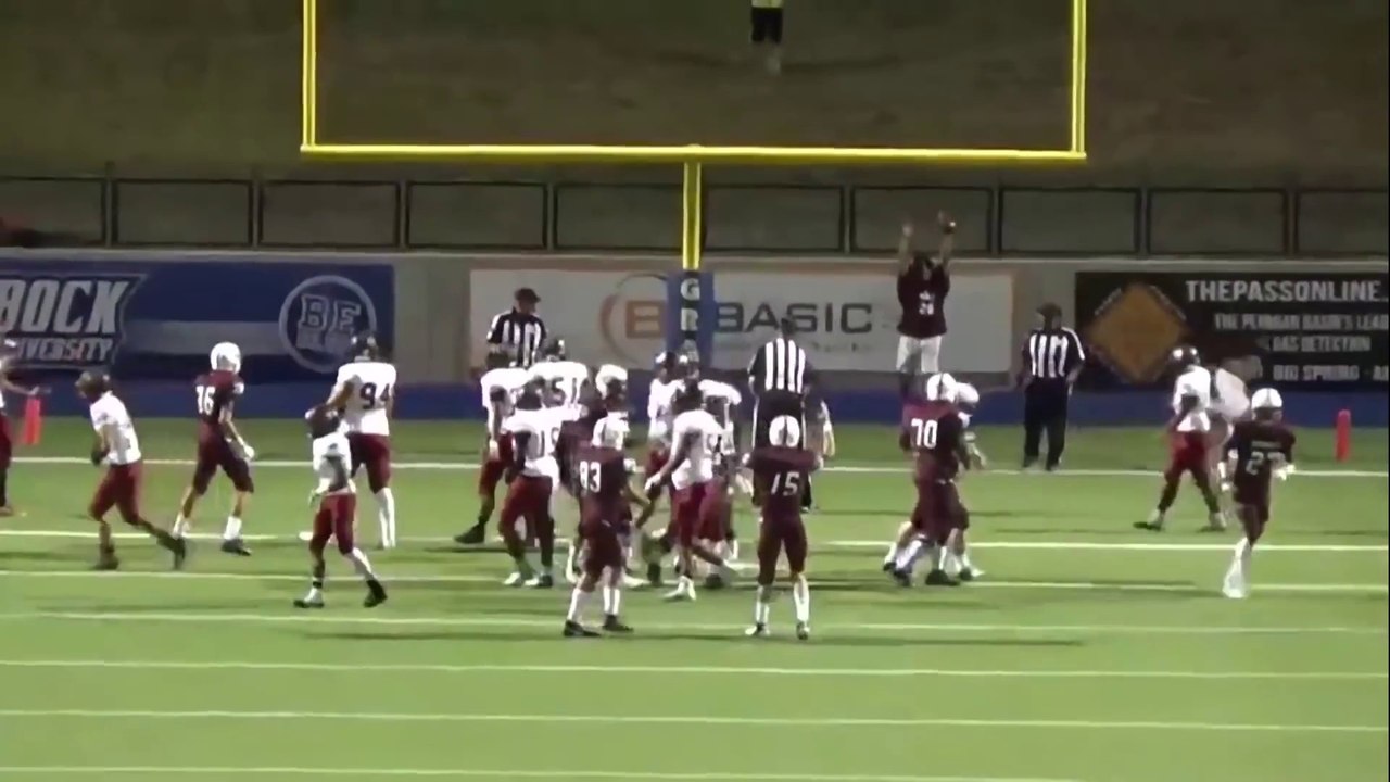 Football Referee gets kicked by ball which scored through the uprights