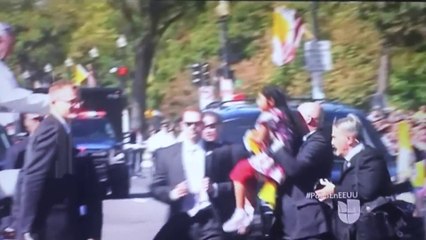 Pope Francis stoped Popemobile to greet a girl walking by the security