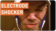 Man Puts Electrode Massager On His Face | Electric Shocks