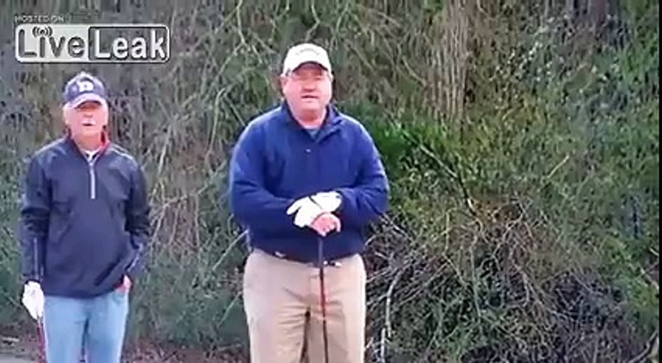Man catches huge fish at golf course.