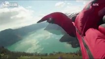 Crazy close shave pass during wingsuit jump.
