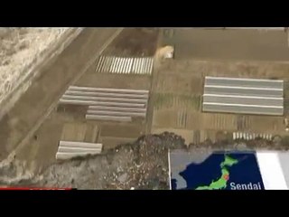 Les vagues du tsunami à Miyagi