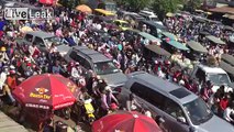LiveLeak.com - Thousands of People and Vehicles Wait for One Little Ferry Boat
