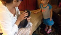 Adorable 2-year-old meets newborn puppy