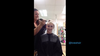 pretty girl having all her hair shaved off