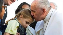At Philadelphia airport, pope kisses head of disabled boy