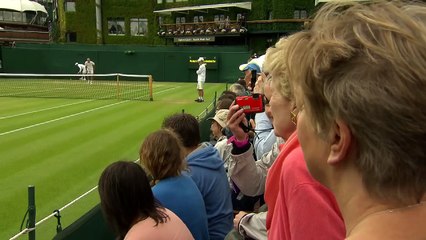 13. Roger Federer hits the practice court