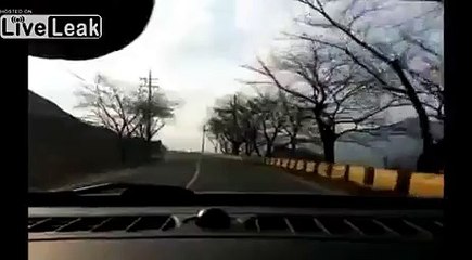Car goes airborne after avoiding turning truck