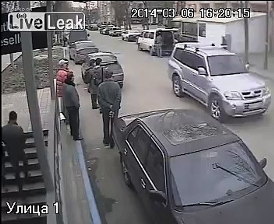 CCTV shows russian paramilitaries holding gun to journalist's head