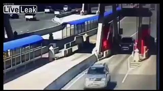 Car smashes into toll bridge