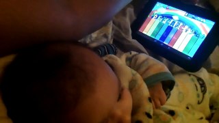 3 month Baby playing piano on tablet.