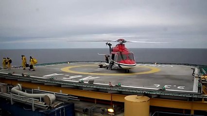 Helicopter landing, refuelling and take off at production platform A6-A