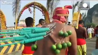 Body piercing and traditional rituals at Hindu ceremony in Malaysia