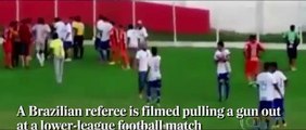 Shocking moment Brazilian referee pulls out gun at match