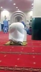 A Man Offering Prayer Wearing His Shoes in Makkah Mosque