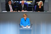 Berlin agrees steps to curb migrants as Merkel faces backlash