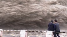 Crowds Watch Jets of Flood Water Shooting Out of Shihmen Dam