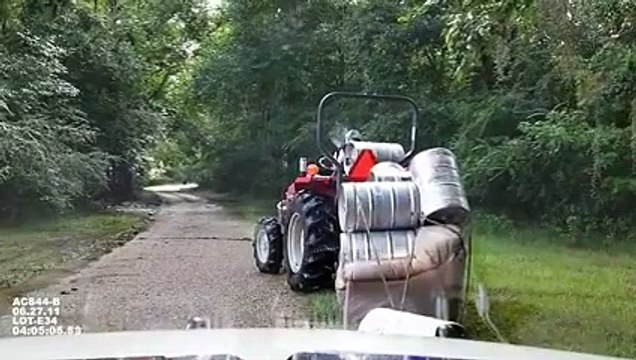 Crazy guy carrying barrels on a couch with a tractor... Why are cops arresting him??? ahaha