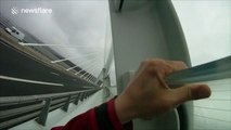 Impressive base jump off massive Millau Bridge in France