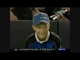 Roger Federer does a trick and hits ball boy