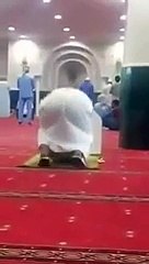 A Man Offering Prayer Wearing His Shoes in Makkah Mosque