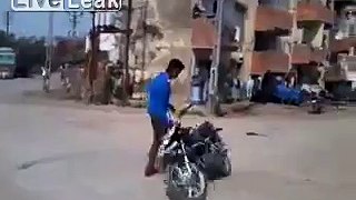 Indian guy showing off with the motorcycle trick