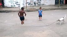 Dog Puppy Helps Kids to play Rope Jump