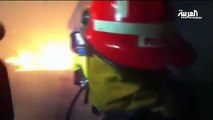 كاميرا تمكن رجال الإطفاء رؤية الضحايا خلف النيران