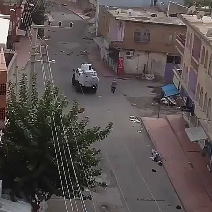 Turkish police fire tear canister on a older man while he's walking