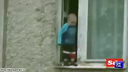 Brave Boy Abdulrahim Playing in window about 20 floor higher from ground