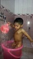 Funny  kid taking bath